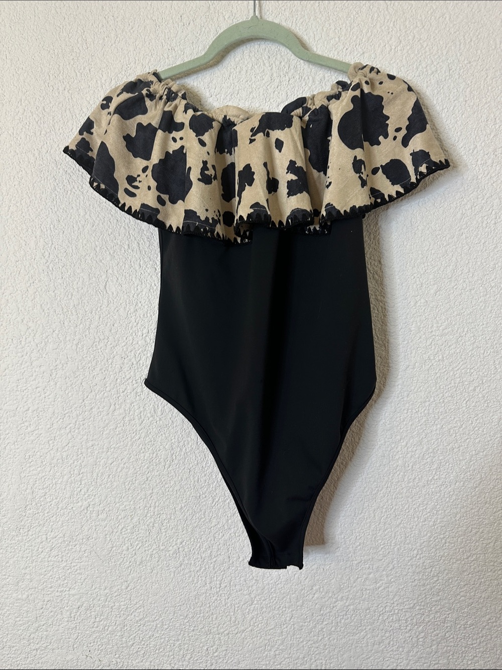 Off-Shoulder Black Bodysuit with Cow-Print Ruffle